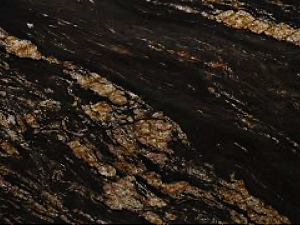 Granito Magma Gold negro con vetas doradas y cobrizas