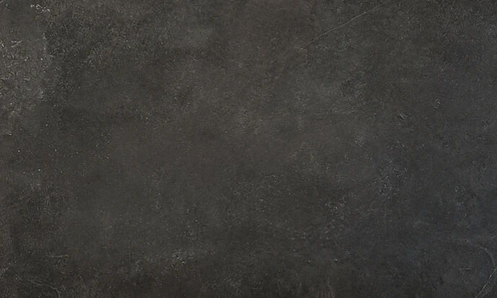 Dekton Fossil acabado mate, gris muy oscuro con textura pétrea